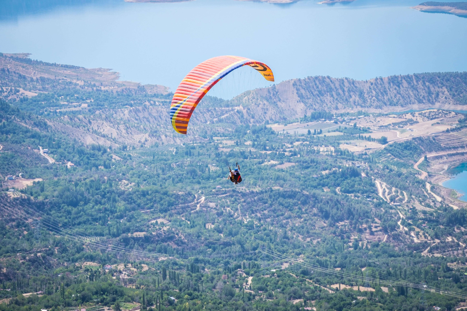 ermenek-yamac-parasutu-noktalari Tandem paragliding experience over Cappadocia's fairy chimneys and hot air balloons at sunrise
